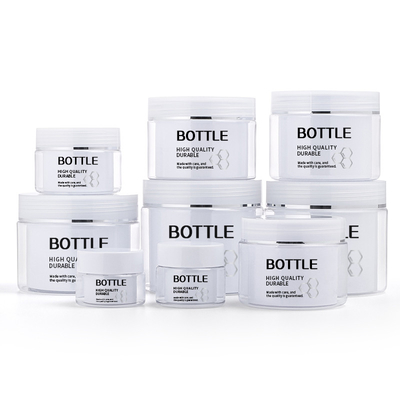 Les pots de mur font face au cosmétique de pot de crème de plastique de maquillage de lotions de soins de la peau de cheveux de main